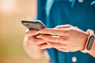 Woman hands on a phone for communication, social media and connection with technology closeup. Girl browsing on social network, doing research on the internet or typing a message with a smartphone