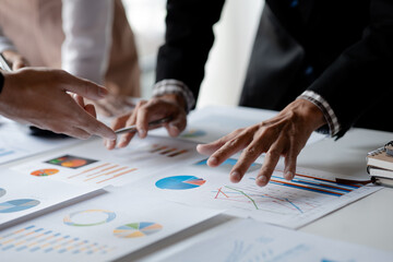 The sales department is having a monthly summary meeting to bring it to the department manager, they are verifying the correctness of the documents that are prepared before bringing in to the manager