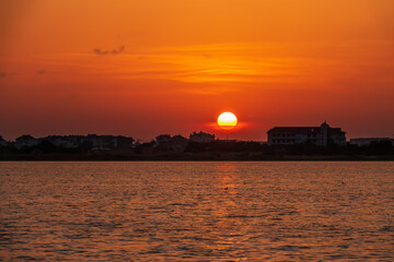 The sun goes down over a lake