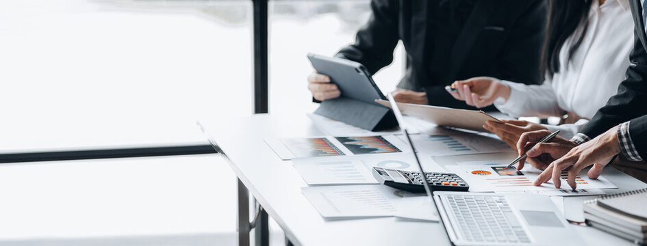 The sales department is having a monthly summary meeting to bring it to the department manager, they are verifying the correctness of the documents that are prepared before bringing in to the manager