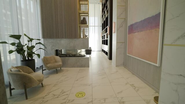 Modern contemporary lobby luxury inside waiting area of high rise condo building in Toronto.