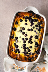 Delicious sweet cheesecake with blueberries in an oval dish, top view
