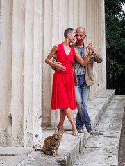 Tango nuevo dance - the famous partner dance with a woman in a red dress with the vibrant & playful style of movement, rich expressions, improvisation and close connection and passion between dancers