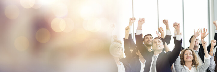 Group of diverse business people raised up hands cooperate for create power of team at business...