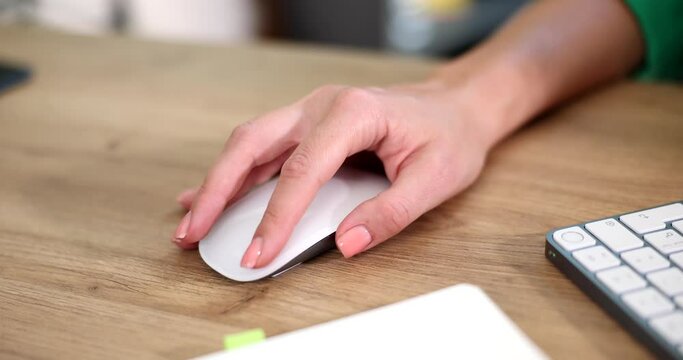 Hand of programmer moving computer mouse at table closeup 4k movie slow motion
