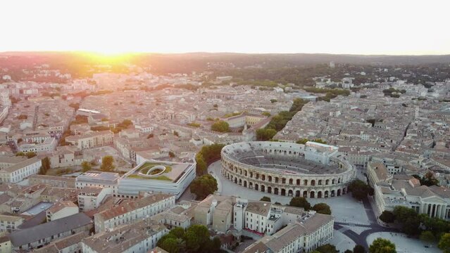 Aerial Pullback Arena of Nimes, Roman Amphitheater with Sunset Sky.