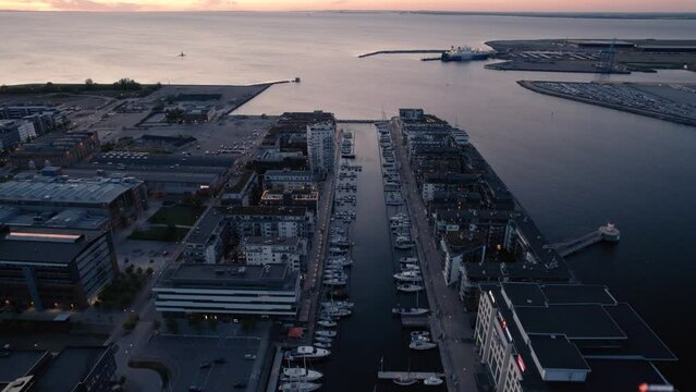 Aerial view of harbor in Malmö Sweden evening, boats spotted