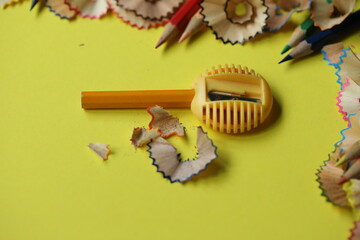 pencils and sharpen on the yellow background with copy space