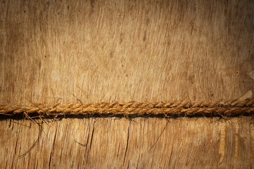 Old wooden background with a rope. Natural background - blank for design. Horizontal photo.