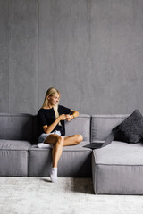 Portrait beautiful young woman use smart mobile phone on sofa in living room