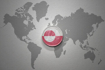 euro coin with national flag of greenland on the gray world map background.3d illustration. © luzitanija
