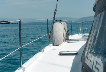 sailing catamaran front deck when cruising, amazing seascape, holiday on boat, travelling around the world