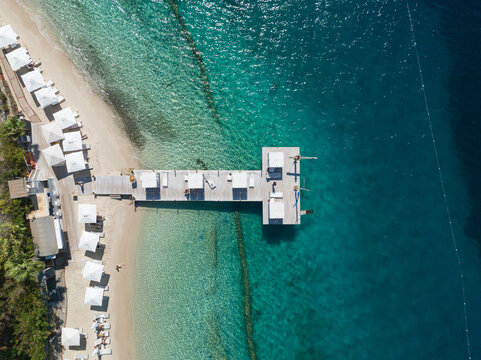 Turquoise Sea and White Umbrellas Drone Photo, Gocek Beach Fethiye, Mugla Turkey