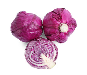 Fototapeta premium Whole and cut red cabbages on white background, top view