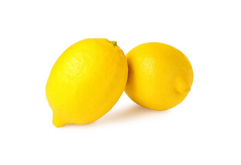 Two fresh ripe lemons isolated on white