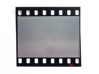 single 35mm dia film snip on white paper background, cool photo placeholder.