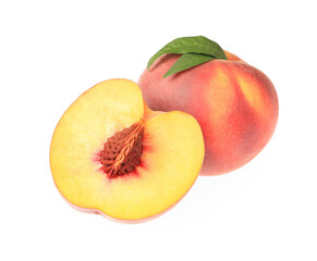Whole and cut delicious peaches with green leaves isolated on white
