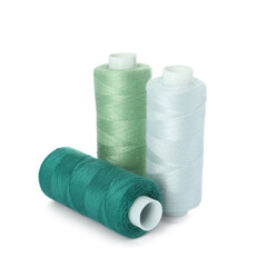 Different colorful sewing threads on white background