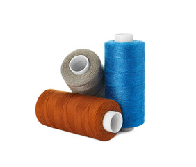 Different colorful sewing threads on white background