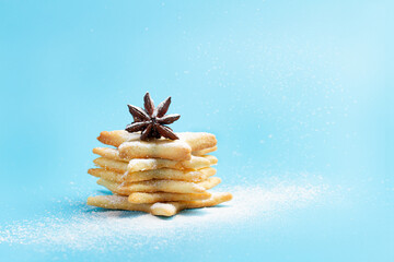 Christmas tree made of gingerbread cookies with powdered sugar