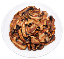 Grilled Slices of champignon mushrooms with stripes from a grill in ceramic plate