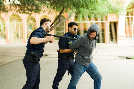 Angry cops agents making an arrest