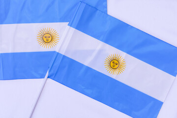 Two Argentine plastic flag on white background. Patriotism symbols