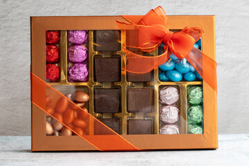 Packed gift chocolate. Packed chocolates on gray background. close up