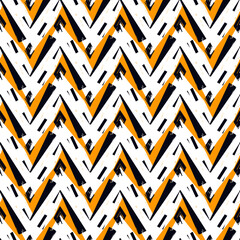 Ethnic seamless pattern. Freehand zigzag stripes print. Boho chic design background. Tribal style wallpaper. Brush wavy lines. Handdrawn geometric ornament. Chevron backdrop. Indigenous image