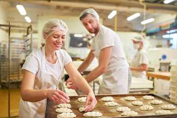 Baker apprentices as a team baking yeast plaits