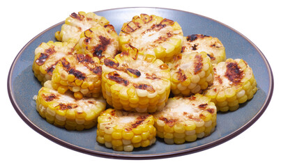 Grilled Slices of corn cobs with stripes from a grill in ceramic plate