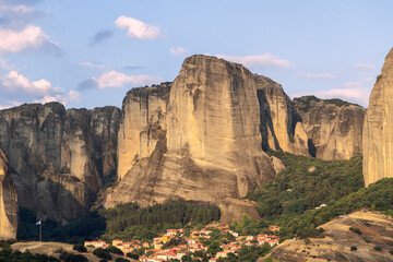 The evening sun added new shades to the tiled roofs of the town of Kastraki, and to surrounding huge monoliths of the rocks of the historic Meteora complexes in Greece