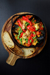 Rice with vegetables and seafood in a pan