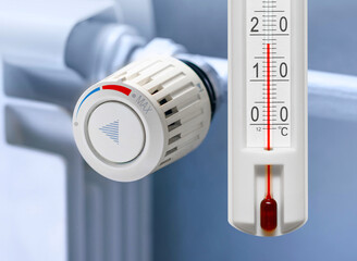 Home Heating radiator Thermostat set to low temperature - obrazy, fototapety, plakaty