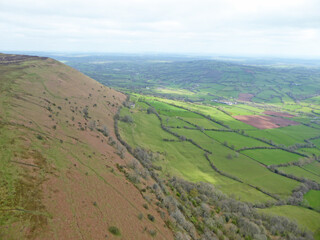 Paragliders flying above the ridge at Pandy, Wales	