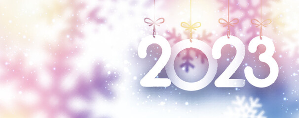 Hanging 2023 sign with snowflakes and copy space.