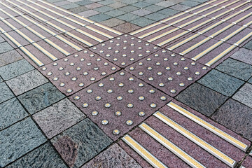 Tactile tiles at the crossing of the road in Tokyo city in Japan