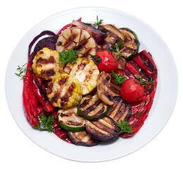 Grilled vegetables mix on a ceramic plate - zucchini eggplant onions corn mushroom tomato