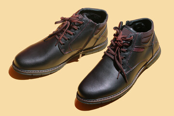 Winter boots. Pair of leather men's shoes. Male black leather elegant shoe..