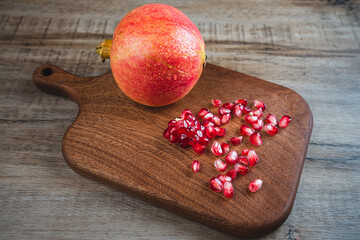 Fototapeta na wymiar pomegranate on wooden background