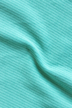  Waved ibbed cotton fabric texture pink, fuchsia color  . Close up rib cotton cloth and textiles pattern. Natural organic fabrics texture background.