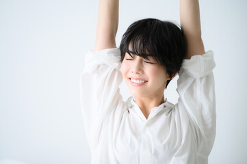 Close-up of a cute woman stretching　