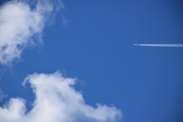 Naklejka na ściany i meble A plane crosses the blue sky, Québec, Canada