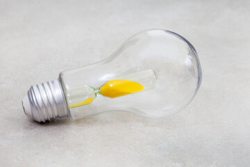 Lightbulb with hourglass, South Africa running out of time with power crisis