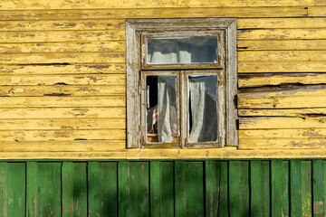 Old vintage wooden house with window in village