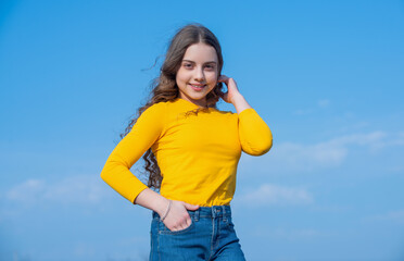 teen girl fashion model on sky background