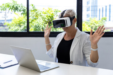 Business Woman in VR headset. Woman using VR glasses for online game. Business woman  sitting inside office building with security interface and using virtual reality headset