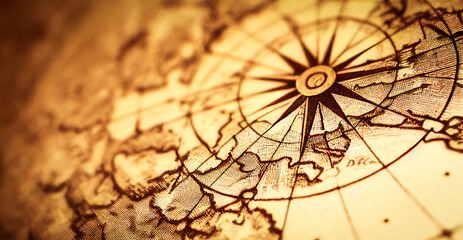 Close-up of a compass rose drawing, on a vintage map
