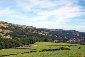 Obraz premium view of the calder valley in calderdale west yorkshire with the village of mytholmroyd visible in the distance