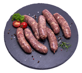 Raw beef or pork grill sausage on stone serving board isolated